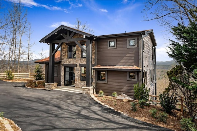 799 Bruce Mountain Rd, Morganton, GA 30560 - contemporary home featuring stone siding, fence, and a mountain view