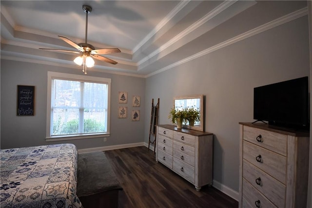 bedroom featuring a tray ceiling, baseboards, dark wood-type flooring, and ornamental molding