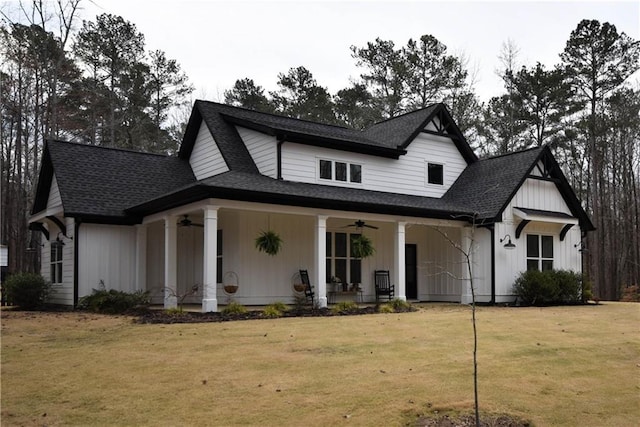 view of front of home featuring a front lawn, a porch, board and batten siding, and ceiling fan