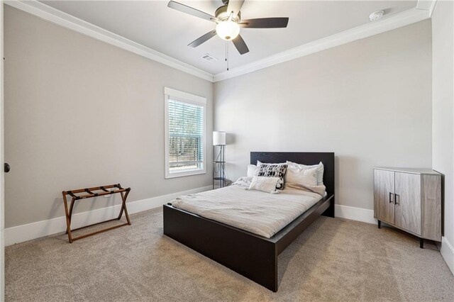 bedroom featuring ceiling fan, light colored carpet, and ornamental molding