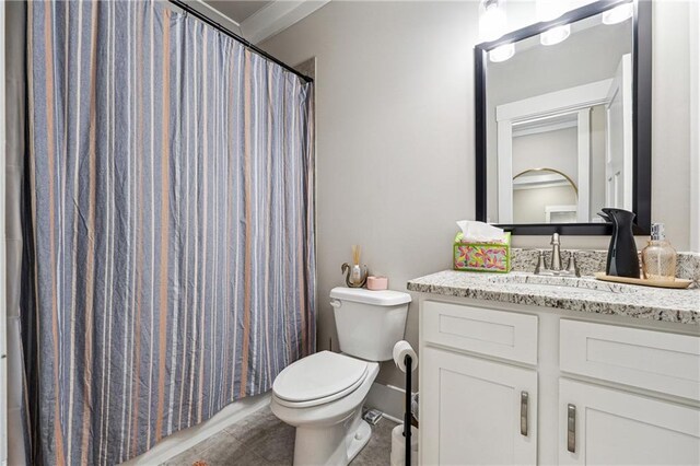 bathroom featuring toilet, tile patterned flooring, a shower with curtain, ornamental molding, and vanity