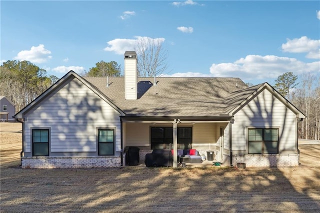 back of house with a patio