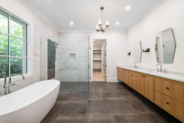 bathroom featuring ornamental molding, vanity, plus walk in shower, and a notable chandelier