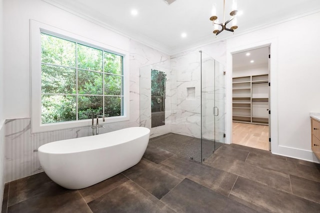 bathroom featuring crown molding, vanity, independent shower and bath, and a notable chandelier