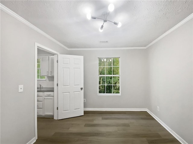 unfurnished bedroom featuring a textured ceiling, multiple windows, and dark hardwood / wood-style floors