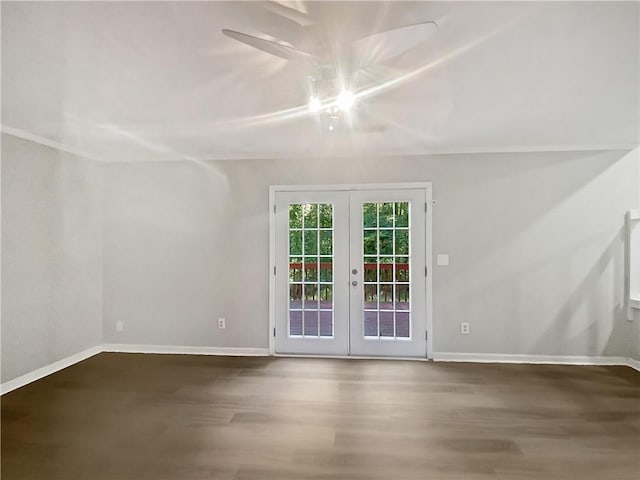 unfurnished room with hardwood / wood-style floors and french doors