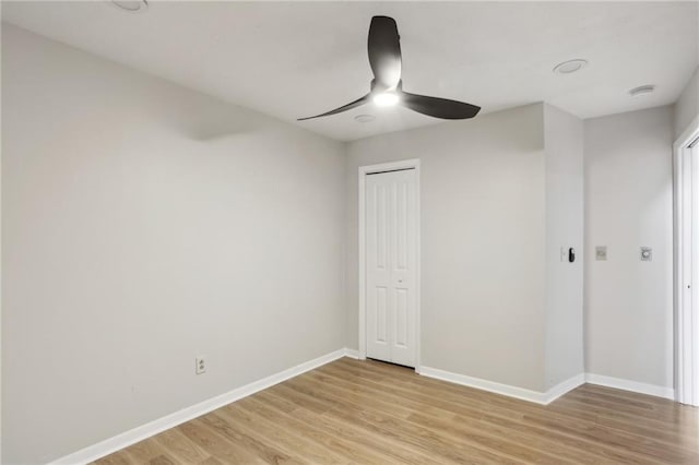 unfurnished bedroom featuring a closet, ceiling fan, and light hardwood / wood-style flooring