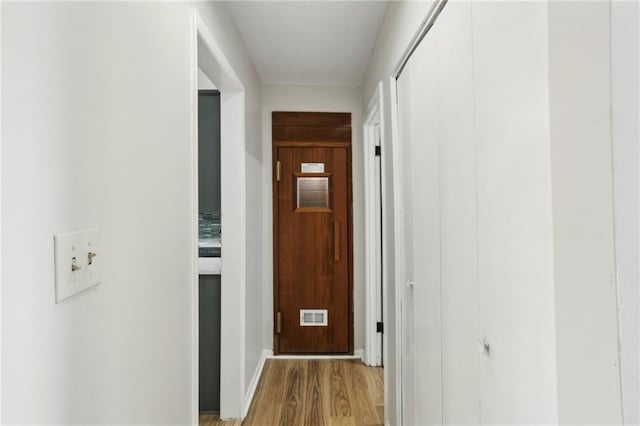 hallway featuring light wood-type flooring