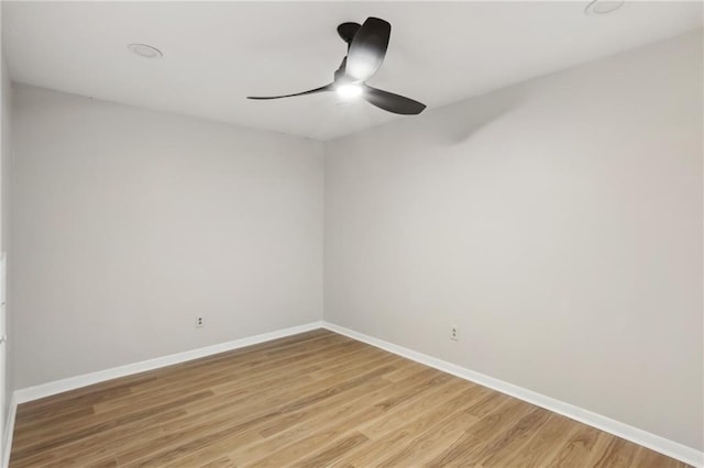 spare room with wood-type flooring and ceiling fan