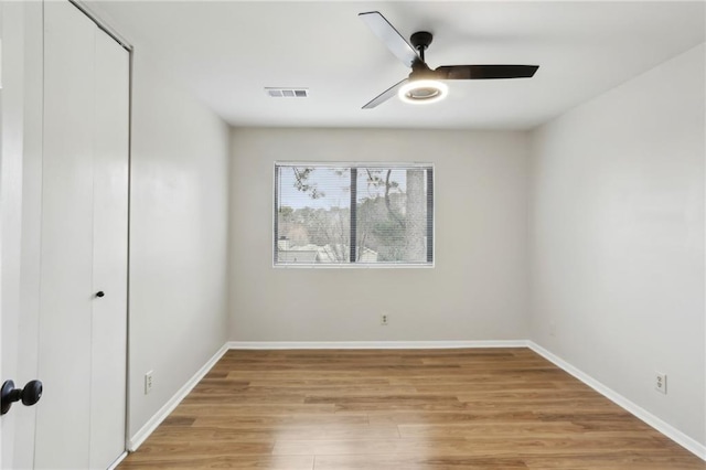 unfurnished room with ceiling fan and light hardwood / wood-style flooring