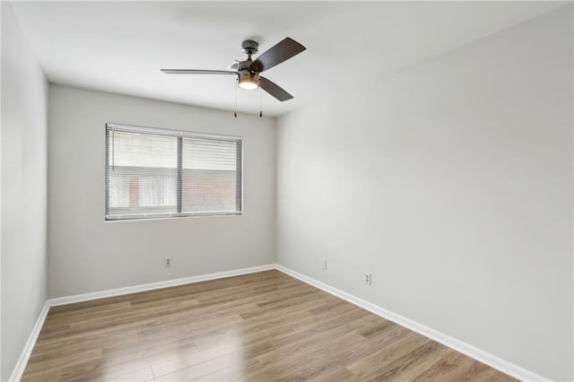 spare room featuring ceiling fan and light wood-type flooring