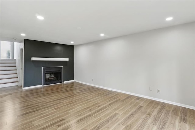 unfurnished living room featuring light hardwood / wood-style floors