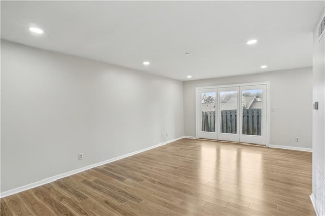 unfurnished room featuring light hardwood / wood-style floors