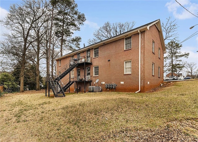 135 E Hill St Unit 24, Decatur, GA 30030 - back of house with a lawn, brick siding, and stairs