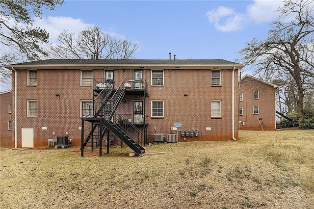 135 E Hill St Unit 24, Decatur, GA 30030 - back of property with stairway, a yard, and brick siding