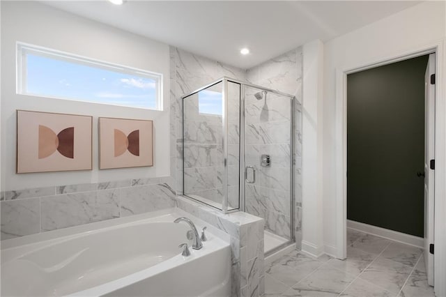 bathroom with shower with separate bathtub