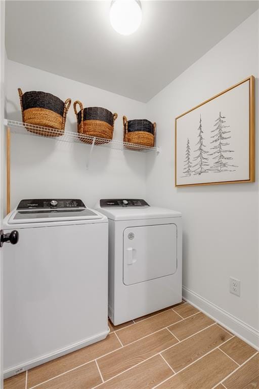 laundry room with independent washer and dryer