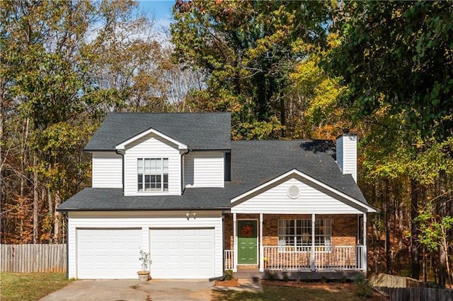 view of front of home featuring a porch and a garage