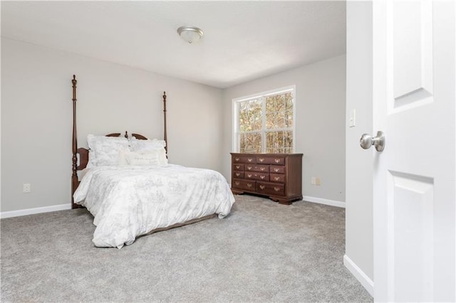 bedroom featuring light colored carpet