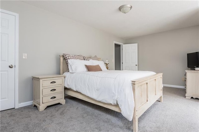 bedroom featuring light carpet