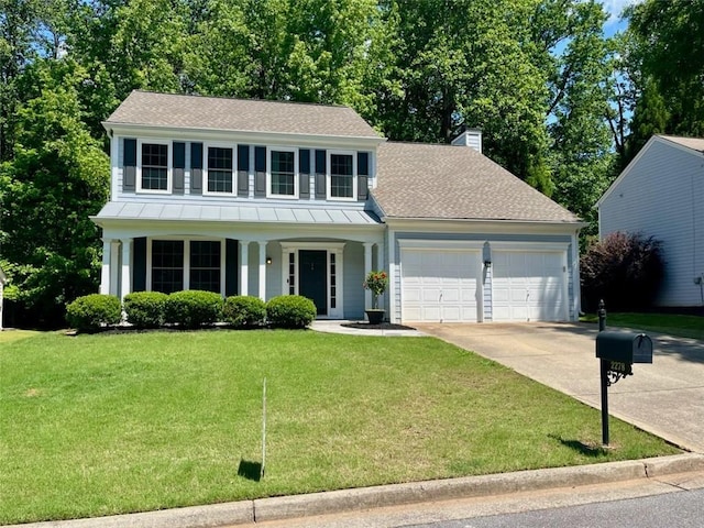 2278 Traywick Chase, Alpharetta, GA 30004 - view of front of house with driveway, a garage, a front yard, a chimney, and a standing seam roof