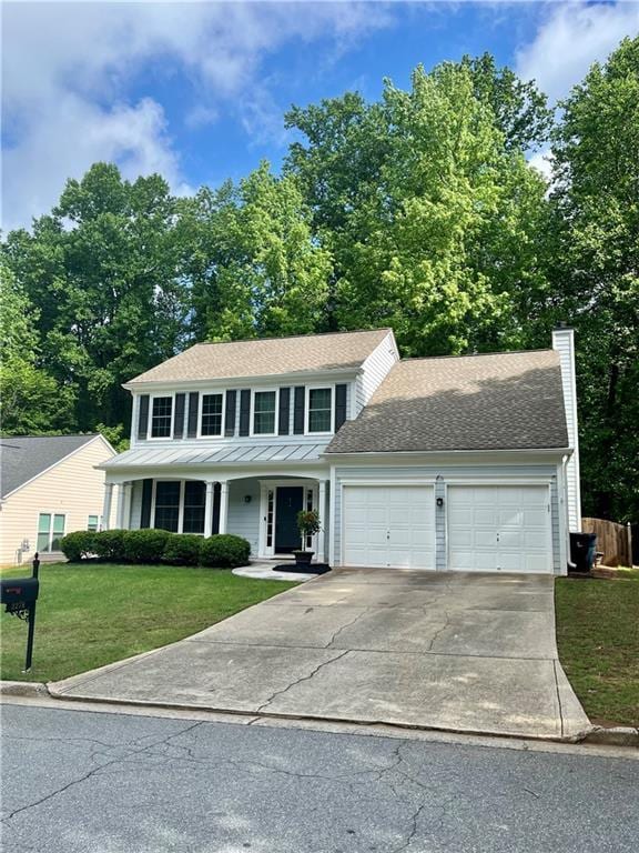 2278 Traywick Chase, Alpharetta, GA 30004 - view of front of house with a chimney, an attached garage, concrete driveway, a front yard, and roof with shingles