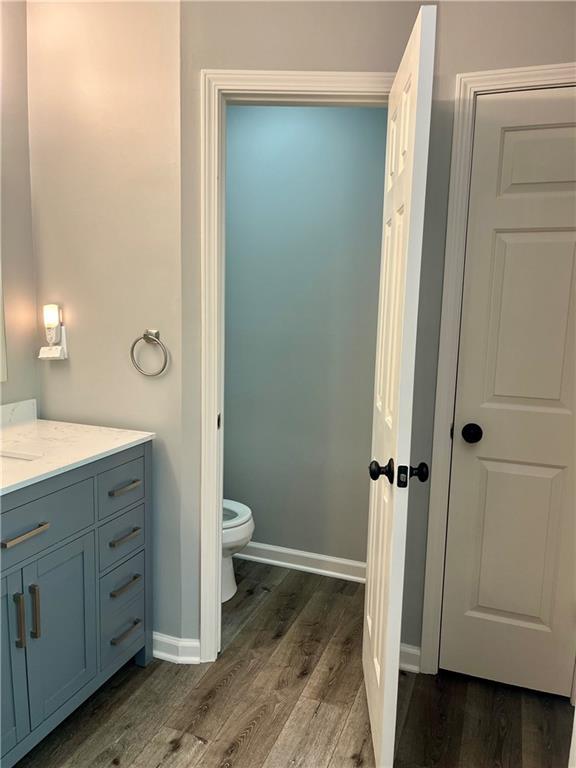 2278 Traywick Chase, Alpharetta, GA 30004 - bathroom featuring toilet, baseboards, vanity, and wood finished floors