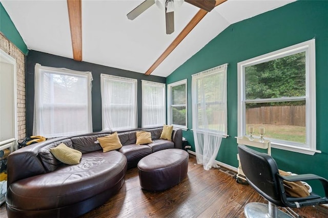 sunroom with vaulted ceiling, ceiling fan, visible vents, and a healthy amount of sunlight