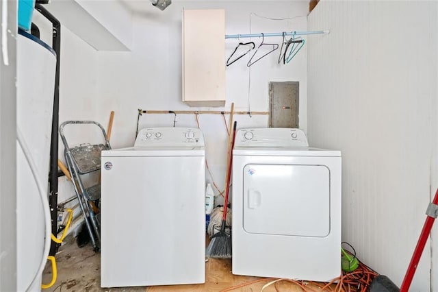 washroom featuring washer and dryer, laundry area, and electric panel