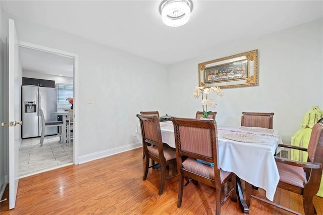 dining room with wood finished floors and baseboards