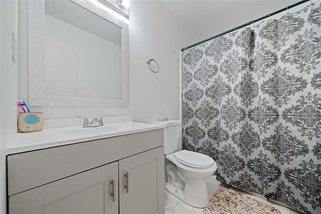 bathroom featuring vanity, toilet, and a shower with curtain