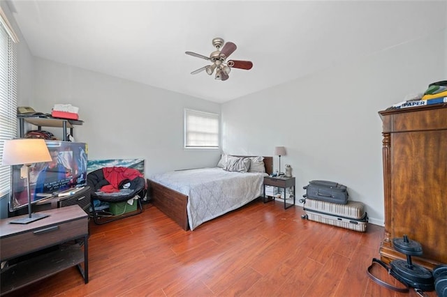 bedroom with ceiling fan and wood finished floors