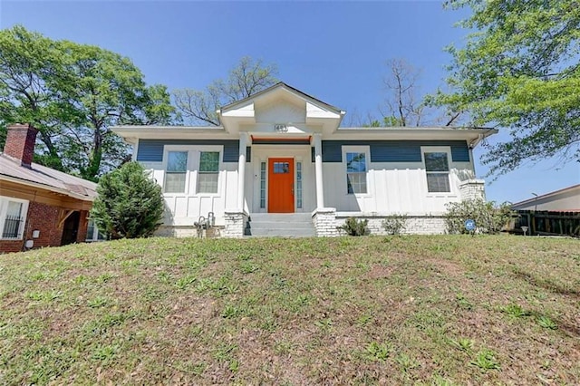 1497 Rogers Ave, Atlanta, GA 30310 - view of front of house with board and batten siding, entry steps, and a front lawn