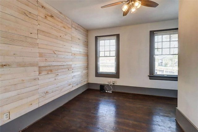 1497 Rogers Ave, Atlanta, GA 30310 - spare room featuring wooden walls, ceiling fan, and hardwood / wood-style flooring