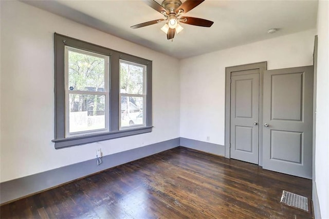 1497 Rogers Ave, Atlanta, GA 30310 - unfurnished room with a smoke detector, dark wood-style floors, and ceiling fan