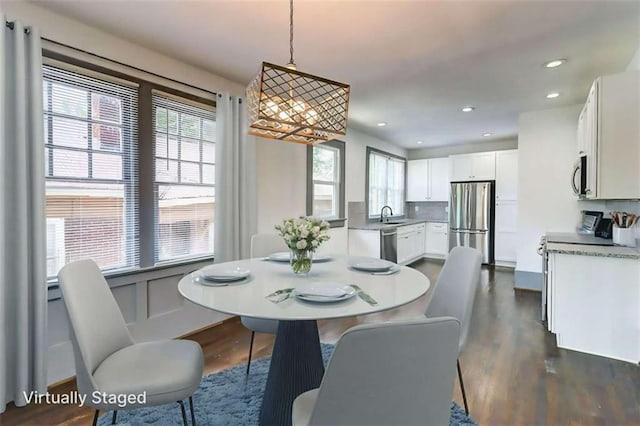 1497 Rogers Ave, Atlanta, GA 30310 - dining room with dark wood-style floors, a chandelier, and recessed lighting
