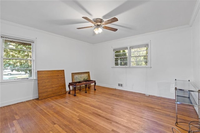 2081 Dodson Dr SW, Atlanta, GA 30311 - spare room featuring light wood finished floors, ceiling fan, ornamental molding, and baseboards