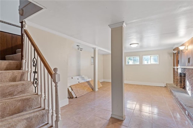 2081 Dodson Dr SW, Atlanta, GA 30311 - below grade area featuring stairs, crown molding, light tile patterned floors, baseboards, and a brick fireplace