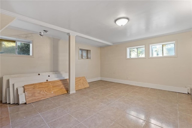 2081 Dodson Dr SW, Atlanta, GA 30311 - basement featuring ornamental molding, healthy amount of natural light, baseboards, and tile patterned floors