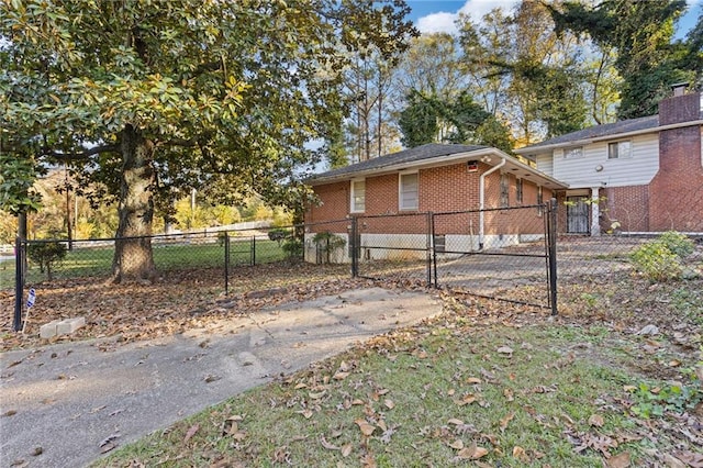 2081 Dodson Dr SW, Atlanta, GA 30311 - view of side of property featuring brick siding and a gate