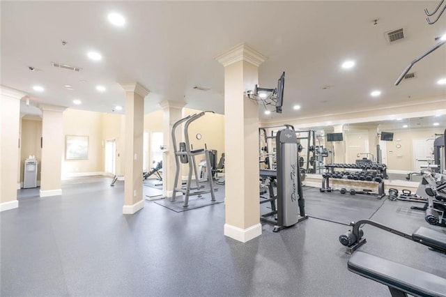 gym with decorative columns, ornamental molding, baseboards, and recessed lighting