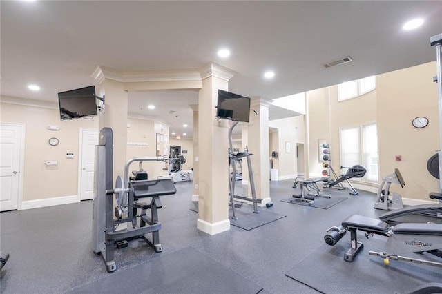 gym with baseboards, crown molding, and recessed lighting