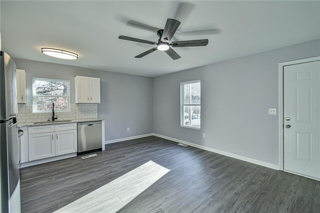 empty room featuring carpet floors and ceiling fan