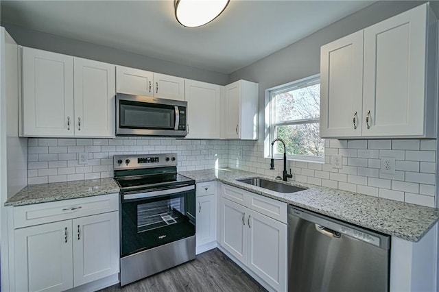 kitchen featuring white cabinets, sink, and stainless steel appliances