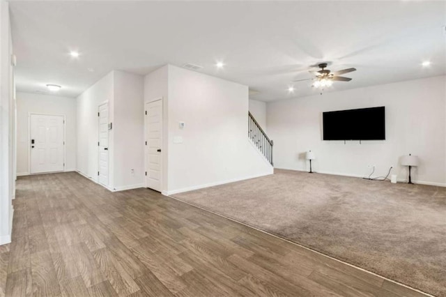 1130 Lyndhurst Ln, Bethlehem, GA 30620 - unfurnished living room with a ceiling fan, stairs, recessed lighting, and wood finished floors