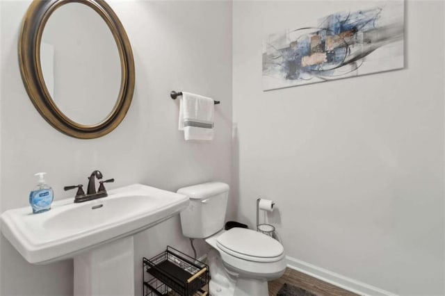1130 Lyndhurst Ln, Bethlehem, GA 30620 - half bath featuring toilet and wood finished floors