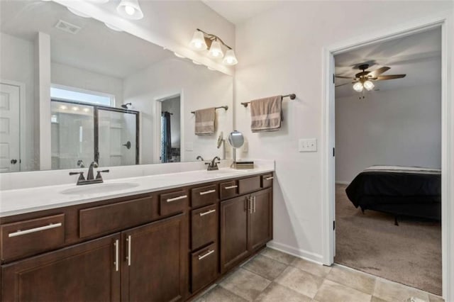 1130 Lyndhurst Ln, Bethlehem, GA 30620 - full bathroom featuring connected bathroom, double vanity, a stall shower, a ceiling fan, and tile patterned floors