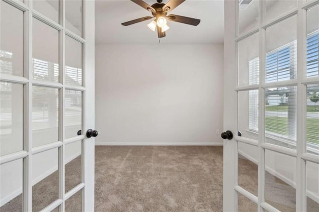1130 Lyndhurst Ln, Bethlehem, GA 30620 - empty room with french doors, carpet floors, and a ceiling fan