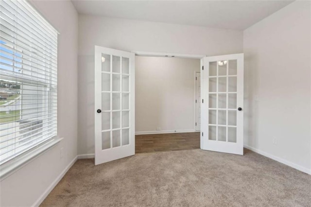 1130 Lyndhurst Ln, Bethlehem, GA 30620 - carpeted empty room featuring french doors and plenty of natural light