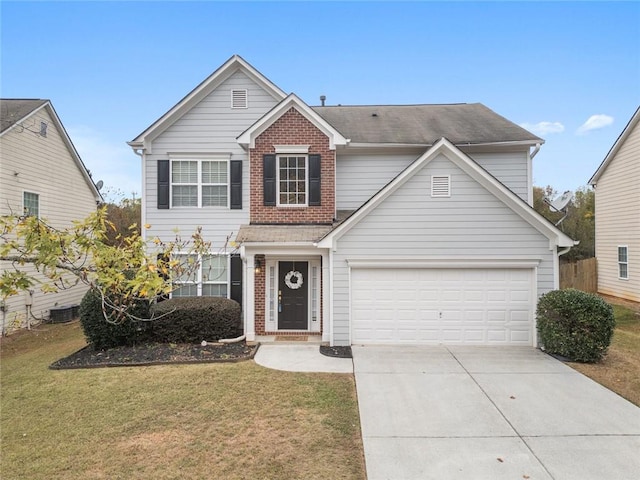 front facade with a garage and a front lawn